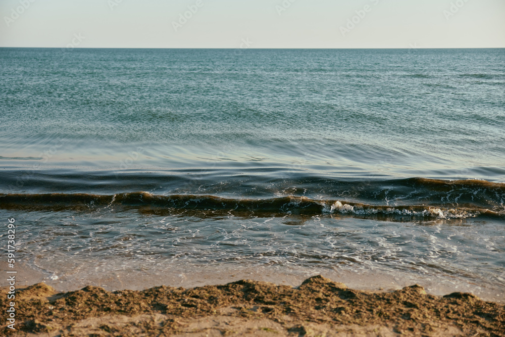 peaceful, calm seascape at sunset in sunny weather peaceful, calm seascape at sunset in sunny weather