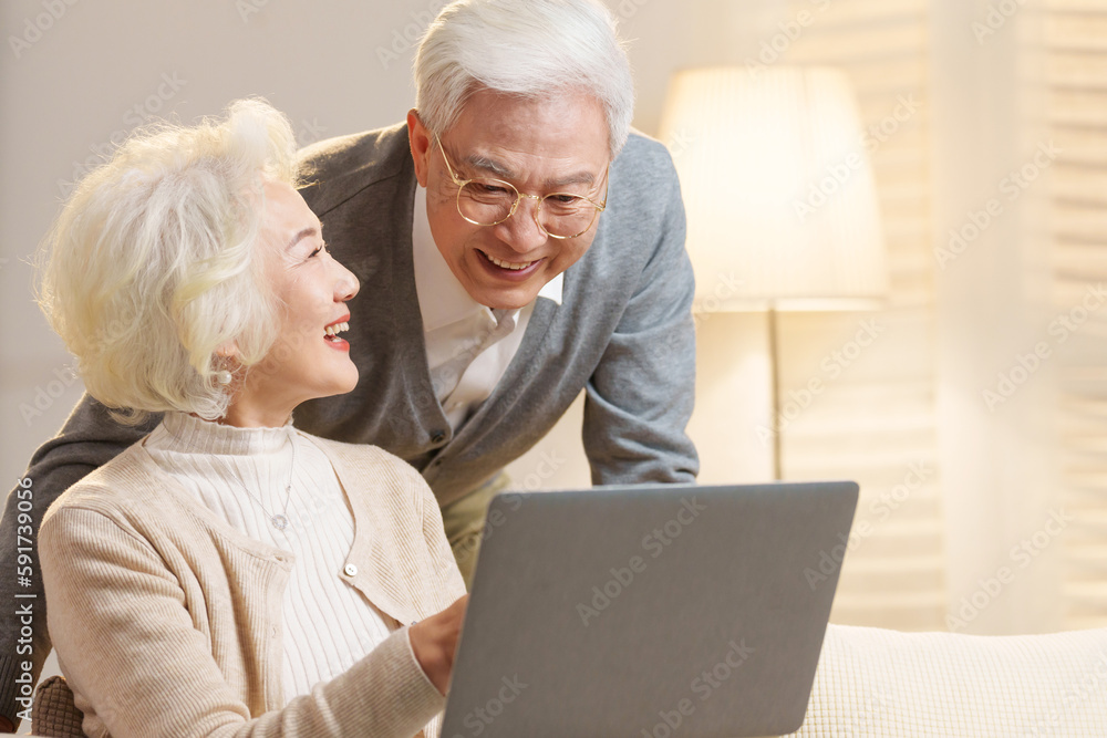 Elderly couple using laptops Elderly couple using laptops