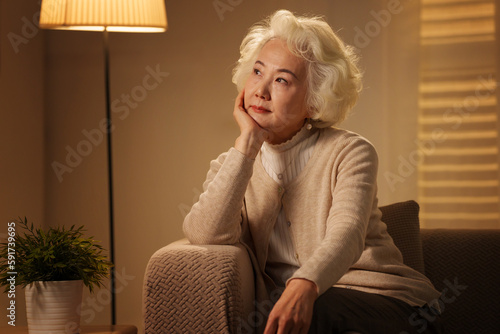 Elderly people sitting on sofa in a daze