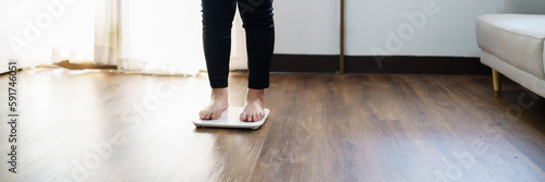 Obese Woman with fat upset bored of dieting Weight loss fail  Fat diet and scale sad asian woman on weight scale at home weight control