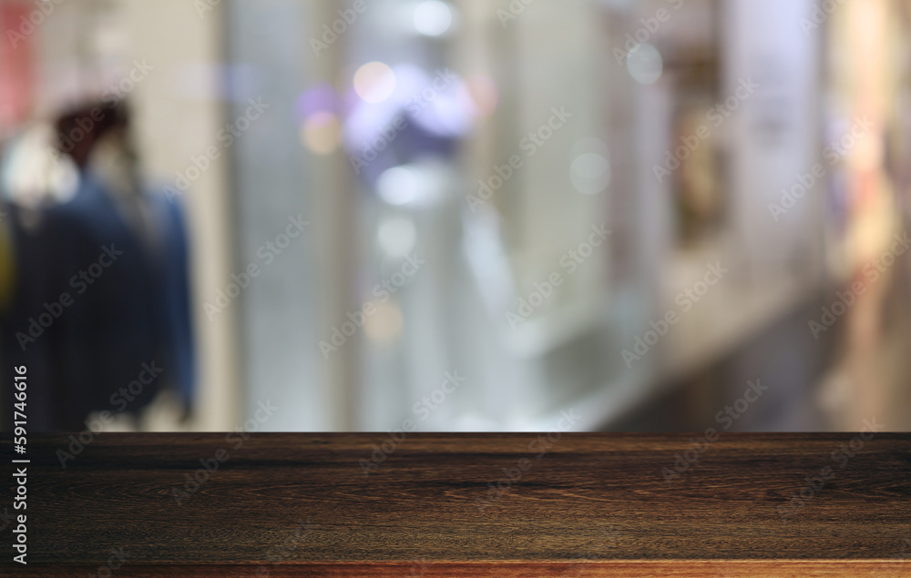 Empty wooden table in front of abstract blurred background of coffee shop . can be used for display or montage your products.Mock up for display of product Empty wooden table in front of abstract blurred background of coffee shop . can be used for display or montage your products.Mock up for display of product