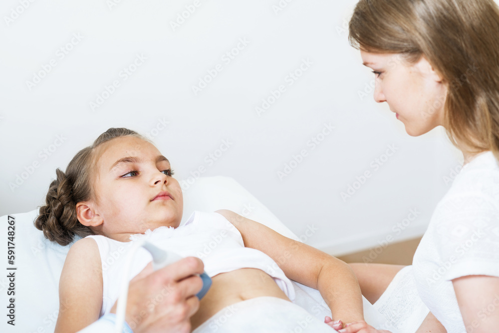 Medical exam little girl by ultrasound equipment Medical exam little girl by ultrasound equipment