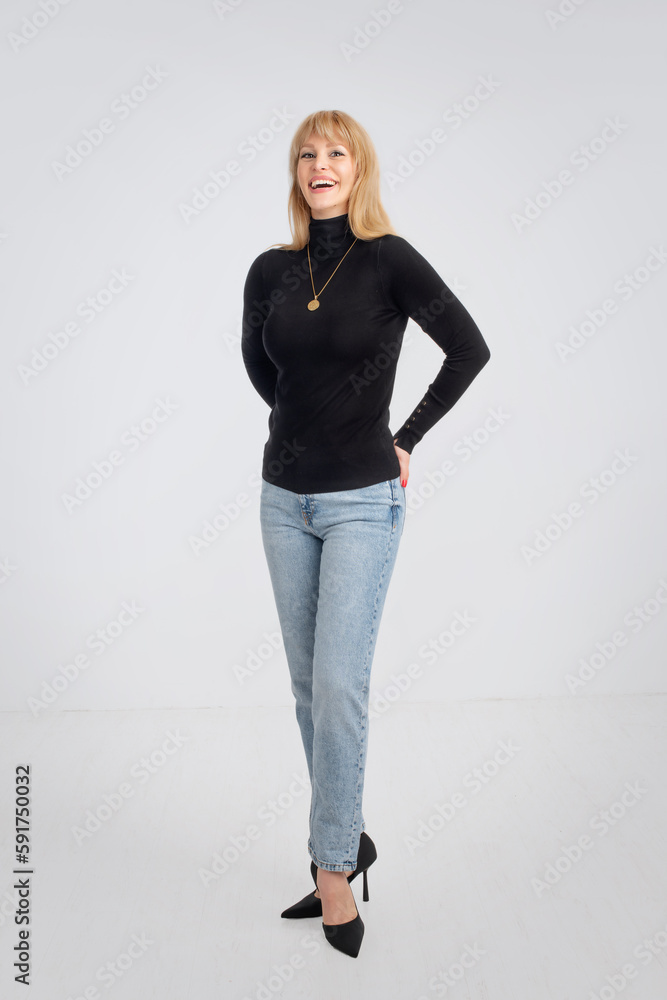 Full length of an attractive middle age woman against white background Full length of an attractive middle age woman against white background