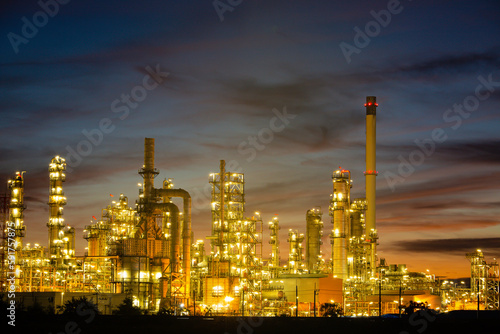 Oil​ refinery​ and​ plant and tower column of Petrochemistry industry in oil​ and​ gas​ ​industrial with​ cloud​ blue​ ​sky the morning