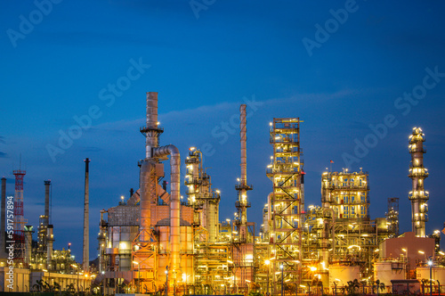 Twilight scene of oil refinery plant and storage white tank oil of Petrochemistry