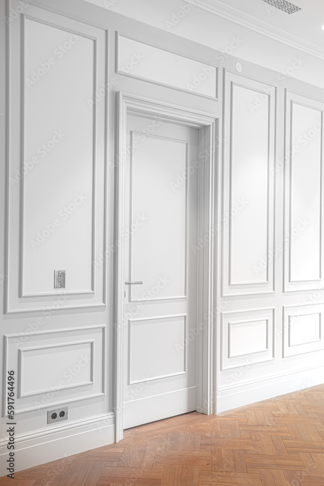 vertical corner frame of luxury interior on white wall with closed door and wooden parquet vertical corner frame of luxury interior on white wall with closed door and wooden parquet