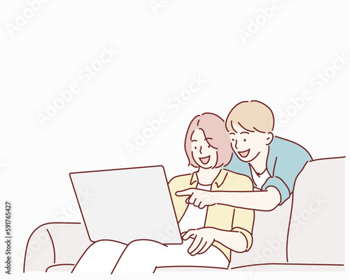 Beautiful young couple is using a laptop, hugging and smiling while sitting on couch at home. Hand drawn style vector design illustrations.