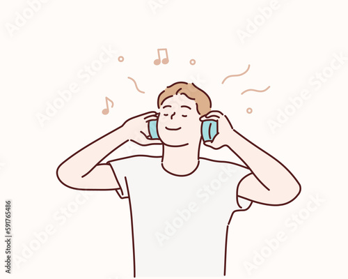 Young man with headphones listening to music. Hand drawn style vector design illustration.