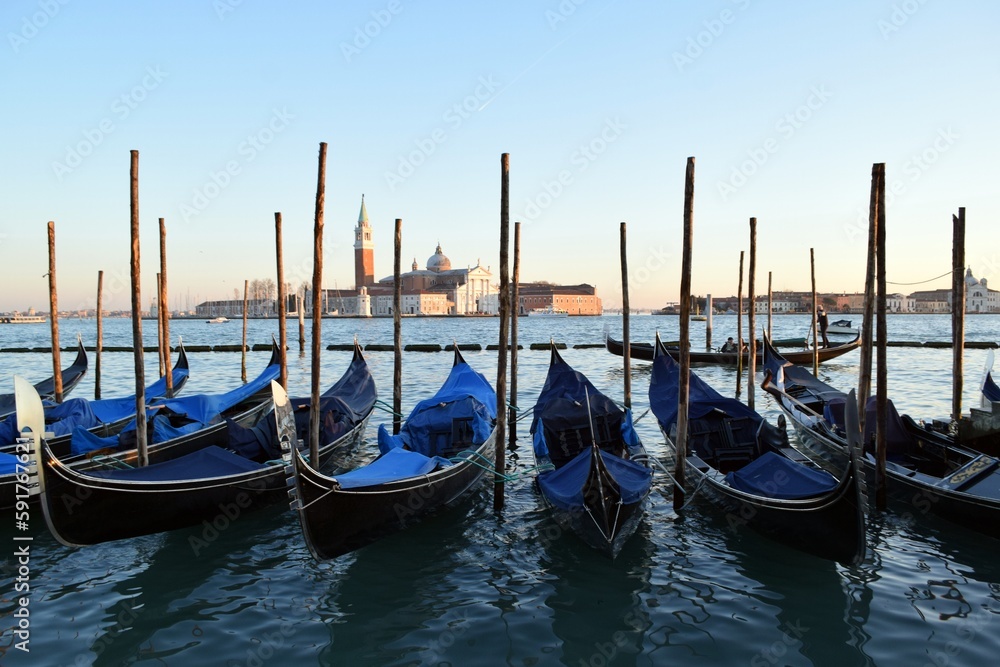 Canoes on the pier of the Venetian Canal during the Venice Festival