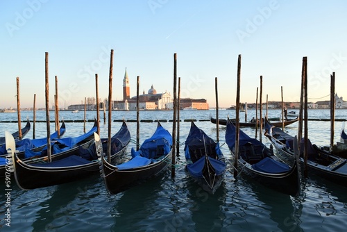 Canoes on the pier of the Venetian Canal during the Venice Festival © Iryna