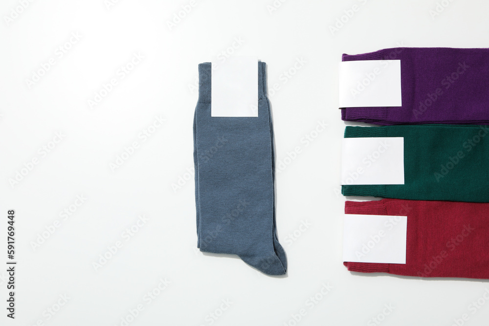 Socks with blank label on white background, space for text Socks with blank label on white background, space for text