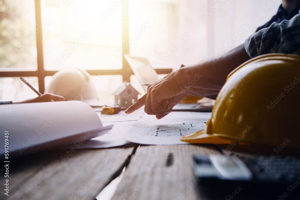 Image of engineering objects on workplace with three partners ...