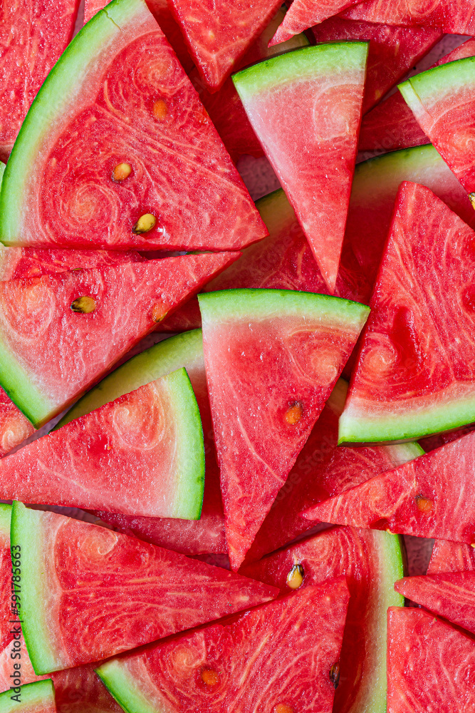 Macro sliced watermelon,Red watermelon triangular piece on white blackground Macro sliced watermelon,Red watermelon triangular piece on white blackground