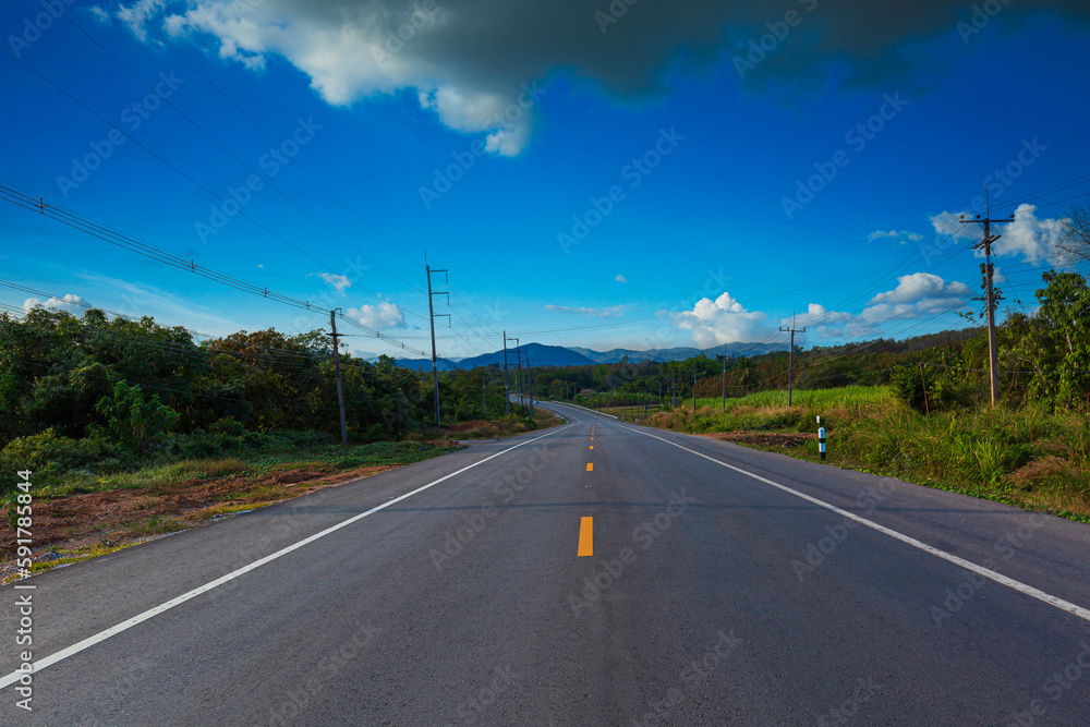 Concrete road and beautiful mountain scenery,asphalt road in thailand Concrete road and beautiful mountain scenery,asphalt road in thailand