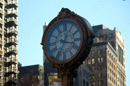 Iron golden vintage clock in downtown Manhattan in New York City