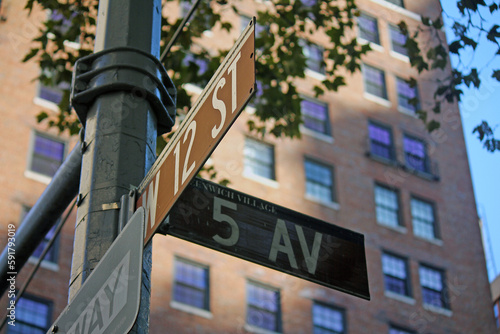 Brown West 12th Street and 5th Avenue Fashion historic sign in Midtown Manhattan in New York City in Greenwich Village Historic District