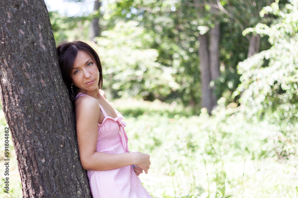 Summer portrait of sensual woman in the park. Summer portrait of sensual woman in the park.
