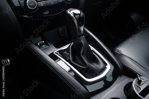 Close up of the automatic gearbox lever, black interior car, Automatic transmission gearshift stick. Closeup a manual shift of modern car gear shifter. © Best Auto Photo