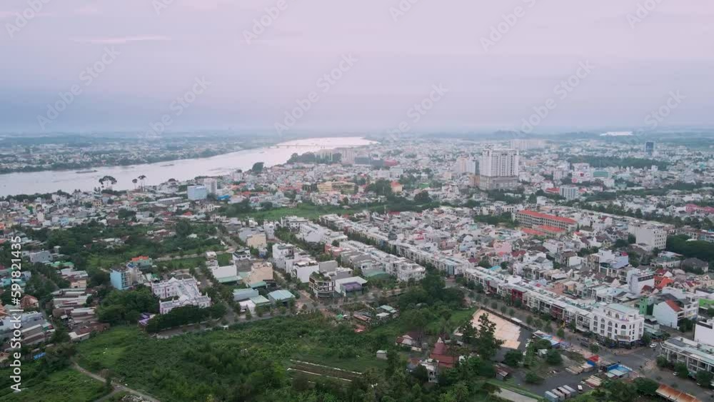 Aerial view of cityscape and peaceful river on a cloudy day Aerial view of cityscape and peaceful river on a cloudy day