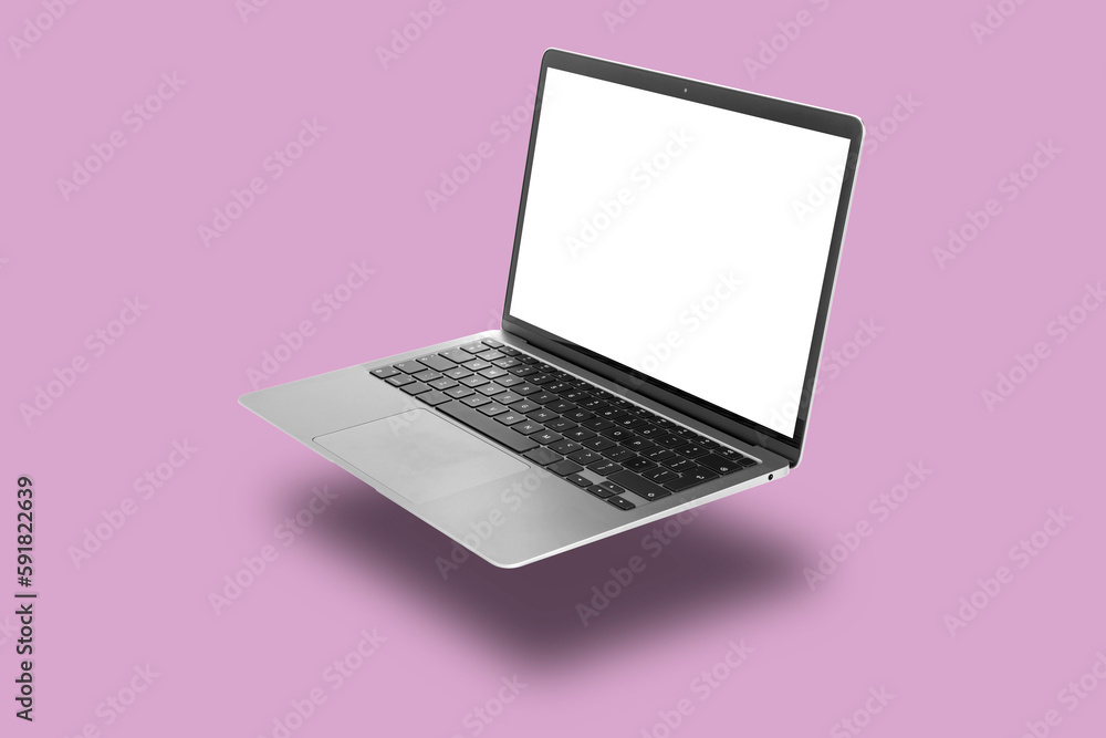One modern laptop flying on violet background