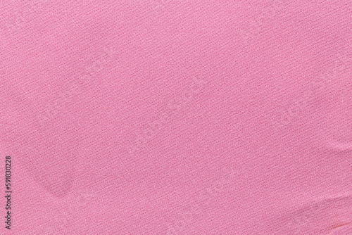 The Pink color fabric cloth with wrinkle texture as background.