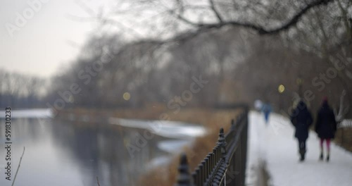 Slow motion shot of snow falling over Central Park's Jacqueline Kennedy Onassis Reservoir photo