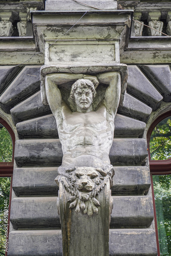 Old Atlas statue on the facade front view