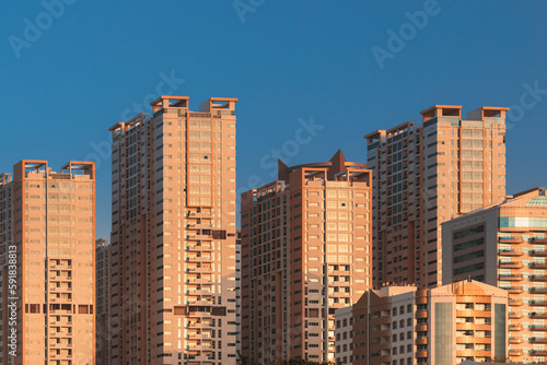 New Residential Multi-storey Houses On Blue Sky. Real Estate, Development Industry. UAE.
