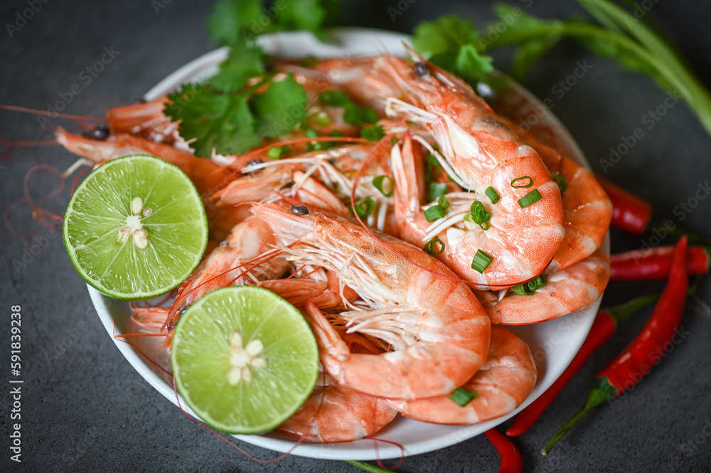 shrimp on white plate background dining table food, Fresh shrimps prawns seafood lemon lime with herbs and spice shrimp on white plate background dining table food, Fresh shrimps prawns seafood lemon lime with herbs and spice