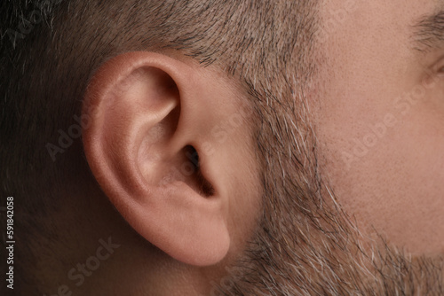 Closeup view of man, focus on ear photo