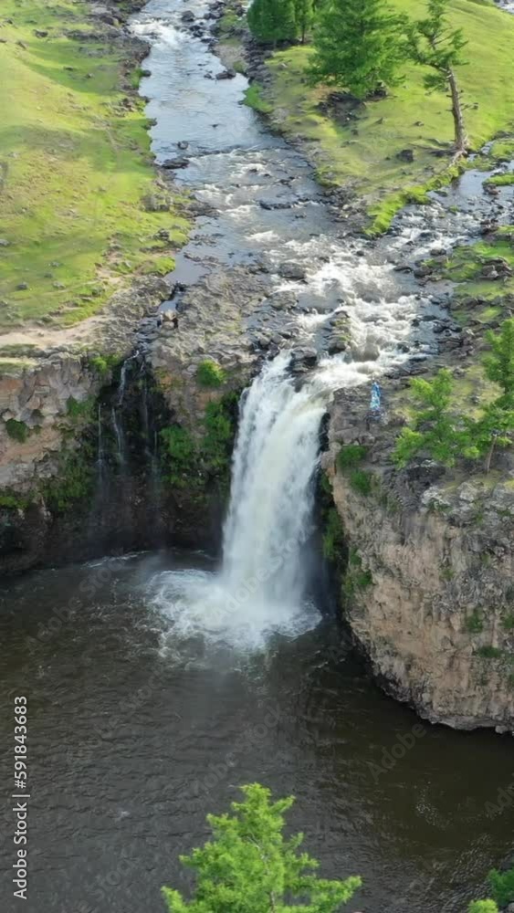 Aerial around view of Orkhon waterfall in central Mongolia. Vertical video Aerial around view of Orkhon waterfall in central Mongolia. Vertical video