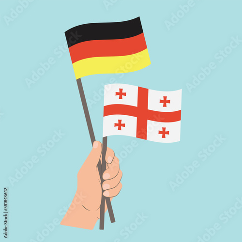 Flags of Germany and Georgia, Hand Holding flags