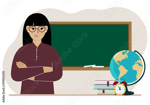 Female teacher near the blackboard. The concept of education, teaching, teacher's day.