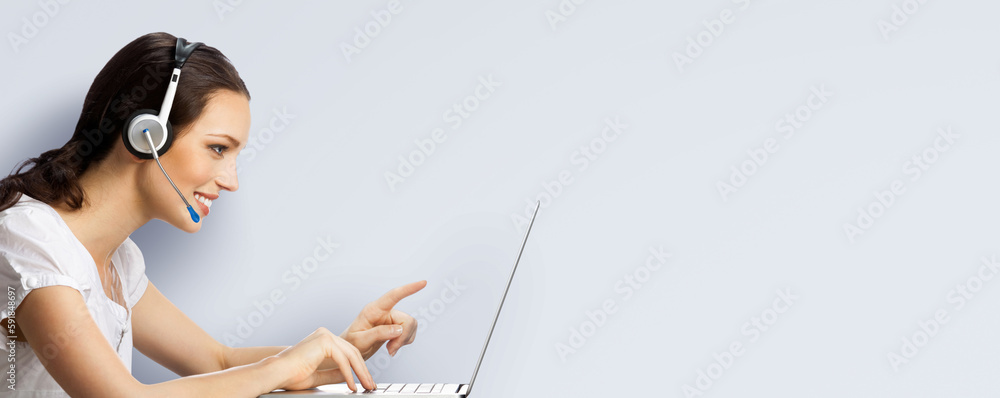 Call center. Profile side image of customer support advertiser sale operator in headset. Pointing businesswoman, phone worker with laptop computer. Answering service agent, light grey gray background. Call center. Profile side image of customer support advertiser sale operator in headset. Pointing businesswoman, phone worker with laptop computer. Answering service agent, light grey gray background.