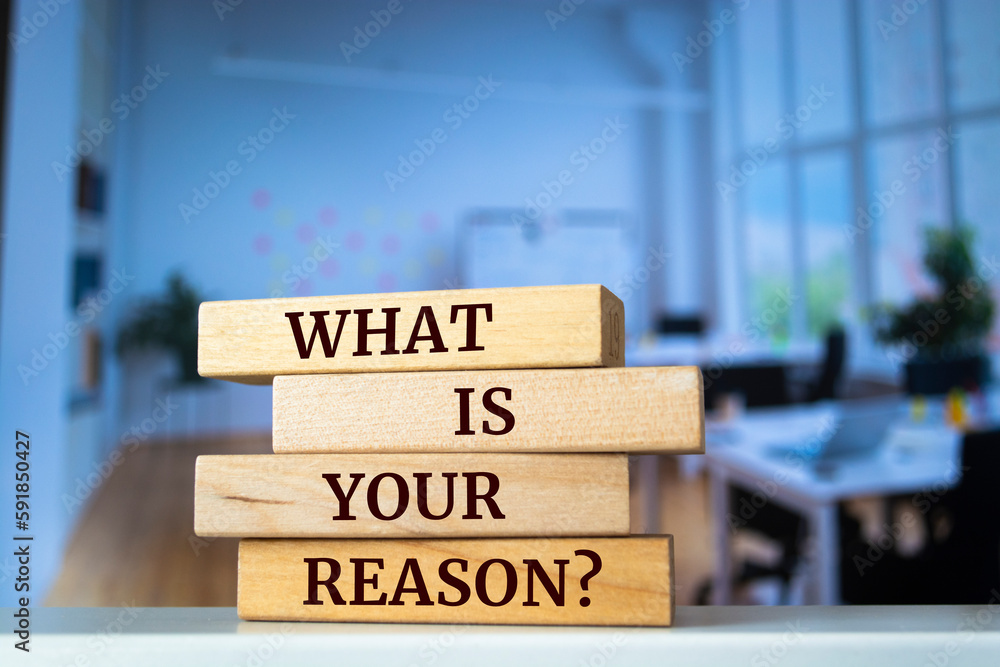 Wooden blocks with words 'what is your reason?'.