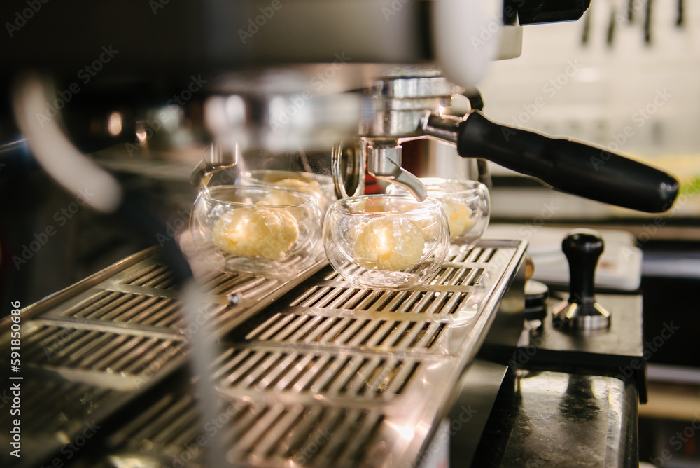 Cafe. A coffee machine that has a glass cup with a scoop of ice cream to make coffee with ice cream Cafe. A coffee machine that has a glass cup with a scoop of ice cream to make coffee with ice cream