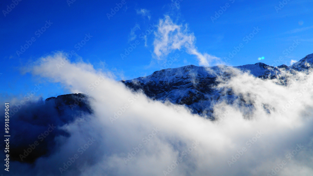 Beautiful view of a mountain covered by  clouds