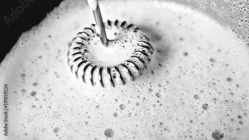 Grayscale shot of milk bubbles from a frother photo