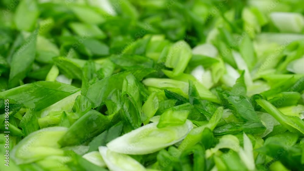 Chopped green onions close up, slider shot. Seasonal greens for salad Chopped green onions close up, slider shot. Seasonal greens for salad