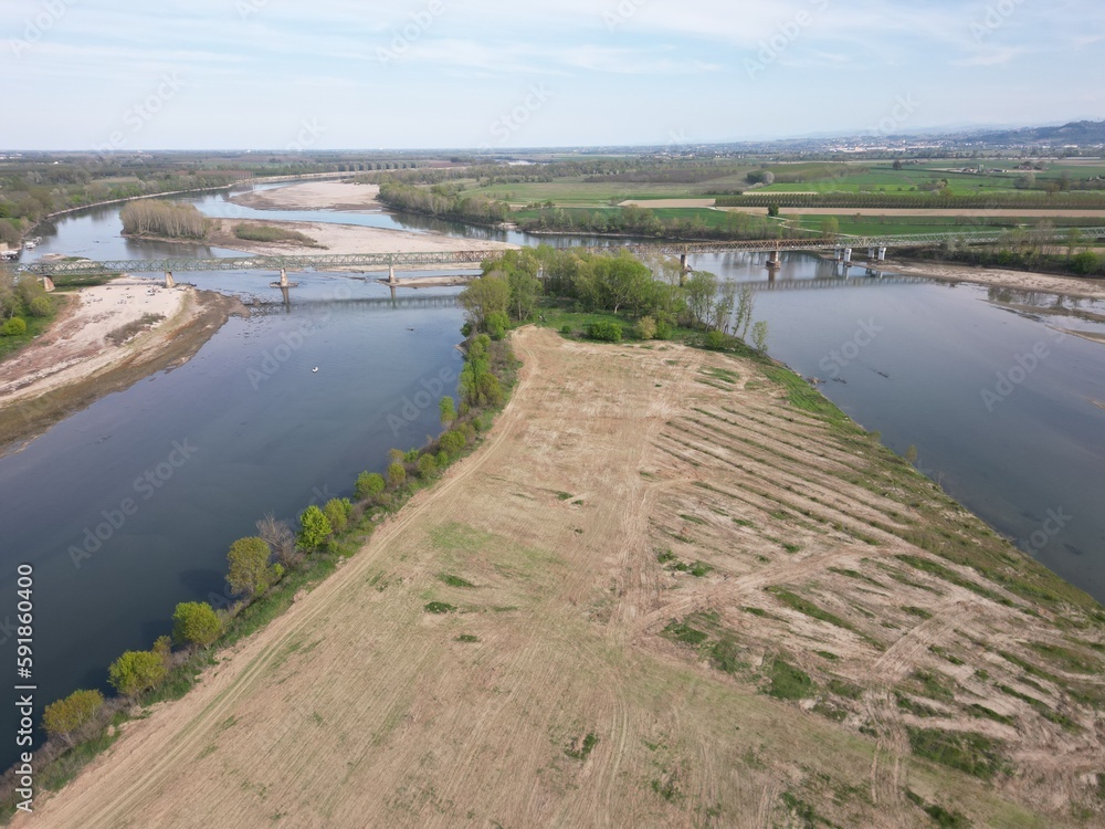 Europe, Italy, Pavia  Drought and aridity river - Po and Ticino , dry beach of sand and water shortage, water emergency in Lombardy - Drone view in Ponte della Becca - Climate change global warming