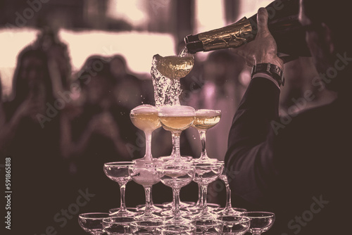 Champagne Tower: Wedding, Elegant Celebration, Bubbles Overflowing, Luxurious Event, Festive Toast, Party Essential, Sophisticated Ambiance, Memorable Moment