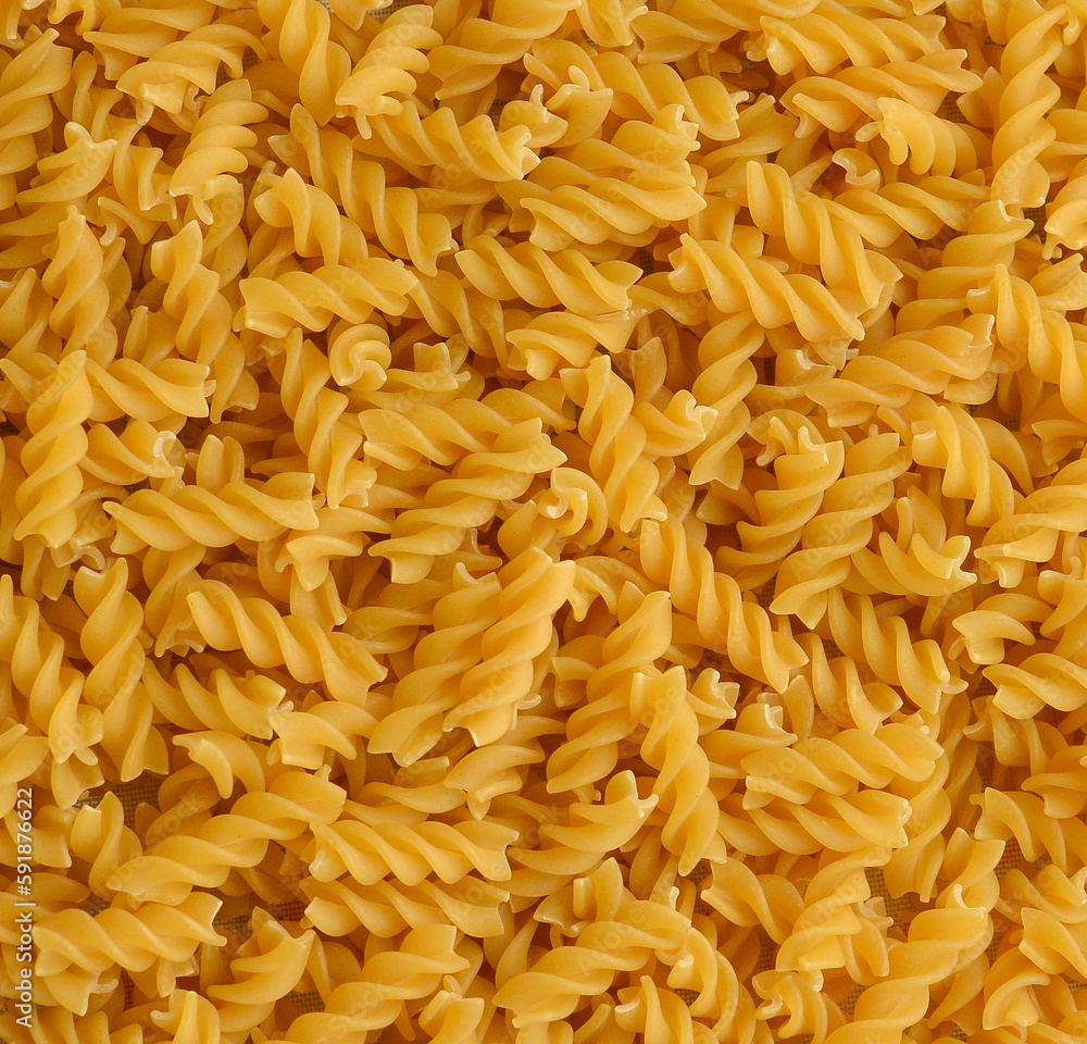 Fusilli background.Pile of raw italian fusilli pasta. Fusilli background.Pile of raw italian fusilli pasta.