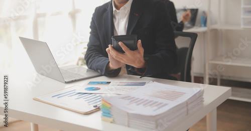 Business professionals. Group of young confident business people analyzing data using computer while spending time in the office