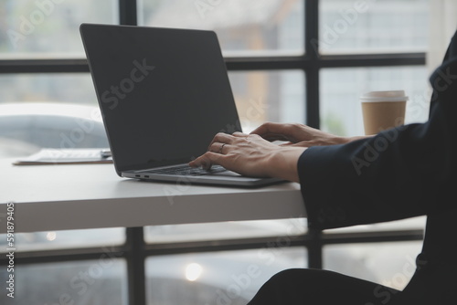 Business professionals. Group of young confident business people analyzing data using computer while spending time in the office