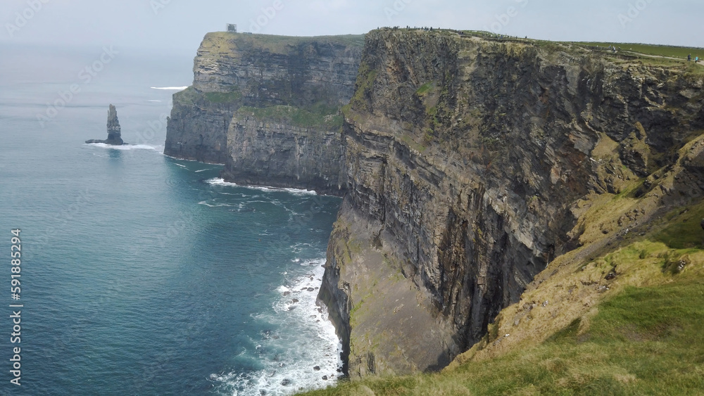 Beautiful view of the Cliffs of Moher on a cloudy day in Clare, Ireland Beautiful view of the Cliffs of Moher on a cloudy day in Clare, Ireland