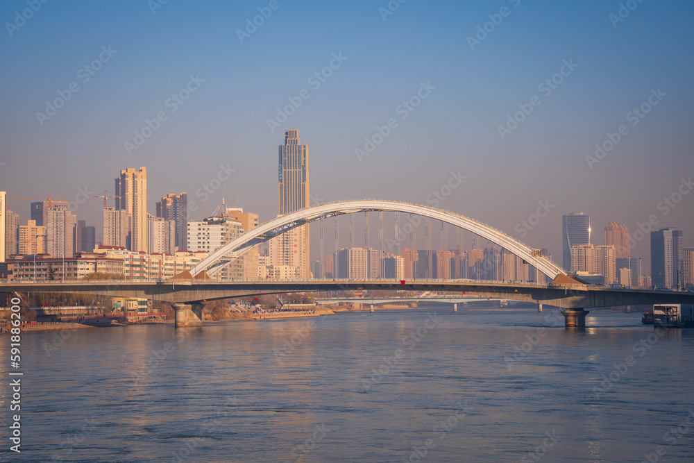 Low angle shot of a bridge constructed above the water in Gansu, Lanzhou, China