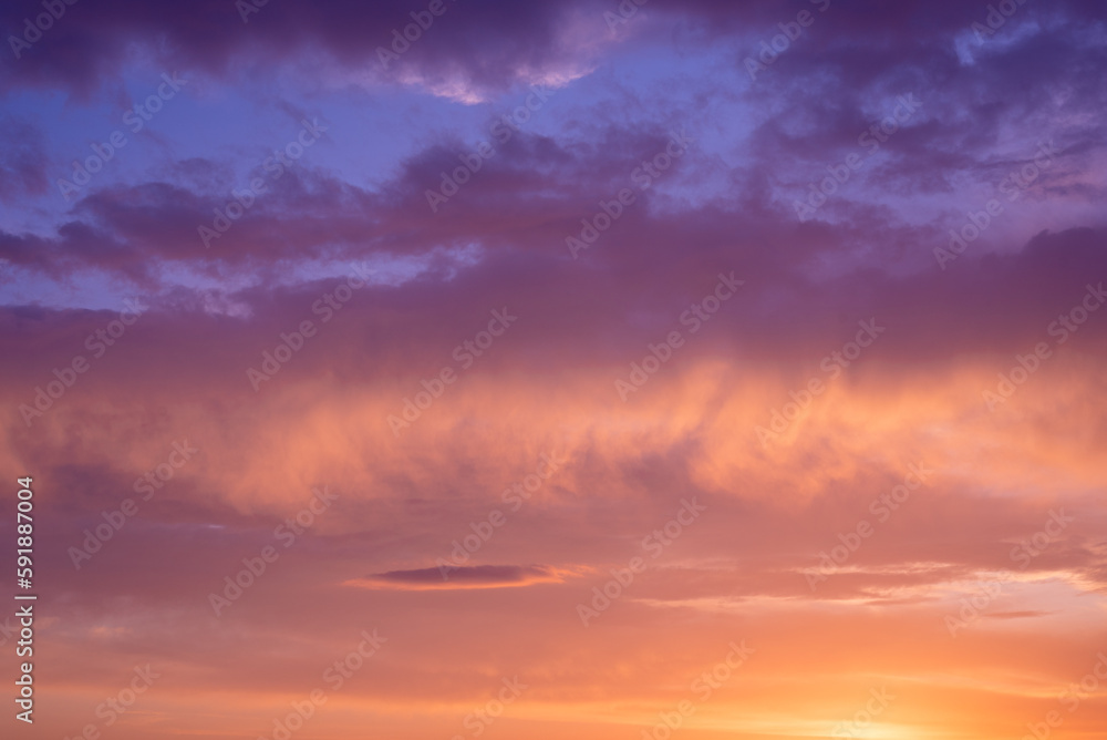 Amazing purple, orange sunset in the clouds.