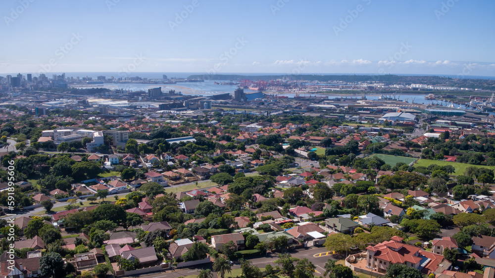 An wide view over the residential area of Durban to the harbor and city skyline in the distance.