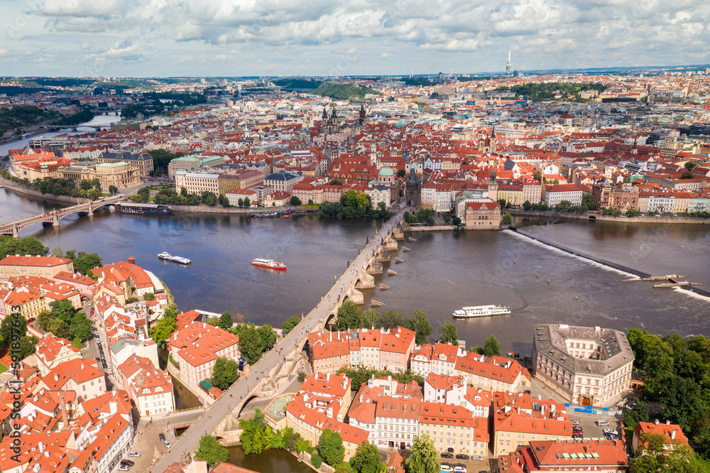 Prague Old Town in Czech Republic with Famous Sightseeing Places in Background. Charles Bridge Iconic 14th century Structure with View, Vltava river and Prague Cityscape. Must Visit City