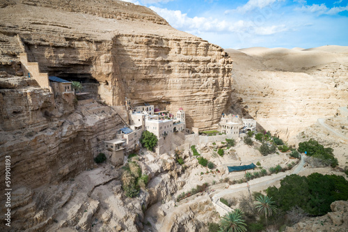 Israel. St. George Orthodox Monastery in Wadi Qelt in Judean desert around. Monastery of St. George of Choziba, Israel. The sixth-century cliff-hanging complex. photo